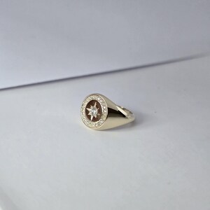 May include: A set of three ceramic mugs with a speckled, matte finish in cream, light grey, and dark grey. Each mug has a simple, minimalist design, suitable for coffee or tea.