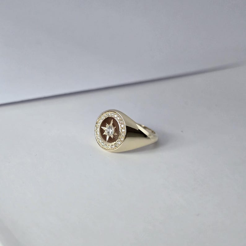 May include: A set of three ceramic mugs with a speckled, matte finish in cream, light grey, and dark grey. Each mug has a simple, minimalist design, suitable for coffee or tea.