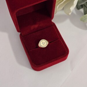 Elegant round diamond signet ring gift presentation in jewelry box