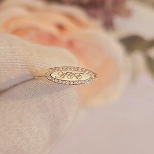 Personalized diamond signet ring engraved surface lifestyle shot