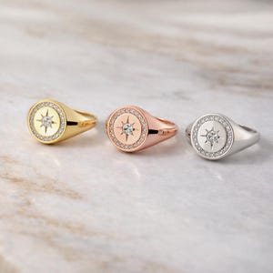 9mm round gold signet ring with center North Star diamond and halo diamonds
