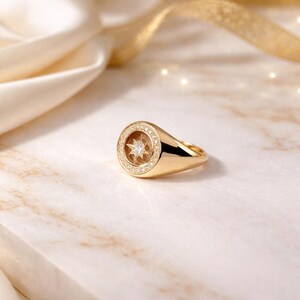 Round North Star diamond signet ring in 14K gold front close-up view