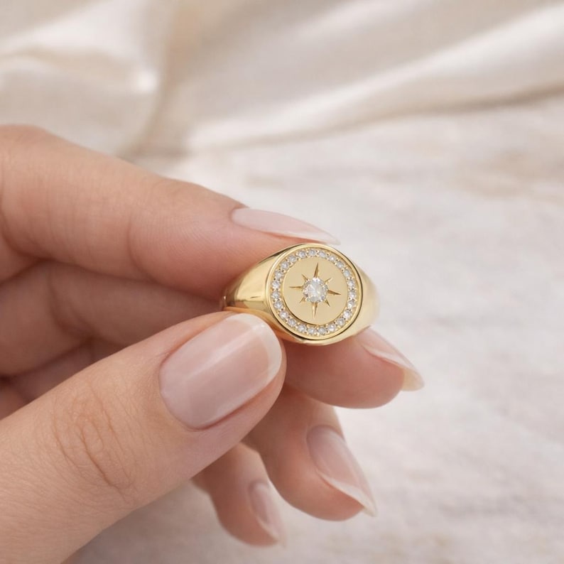 Luxury North Star signet ring worn on finger lifestyle photo