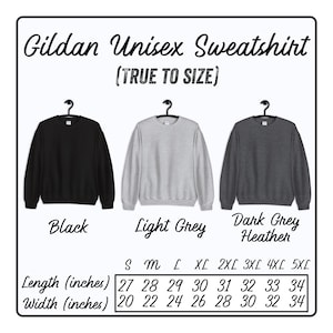 May include: Size chart for a Gildan unisex sweatshirt in black, light grey, and dark grey heather. The chart shows the length and width in inches for sizes S through 5XL.
