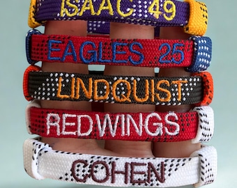 HOCKEY LACE WRISTBANDS (mit Team- / Spielernamen!) - einstellbare, individuelle Hockeyarmbander für Spieler, Trainer und Fans.
