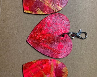 3 valentine key chains painted by dogs Schultz and Wilhelmina