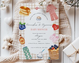 May include: A baby shower invitation with a beige and white checkered background. The invitation features illustrations of pancakes, pajamas, and berries. Text reads "Pancakes & Pajamas BABY SHOWER" with event details.