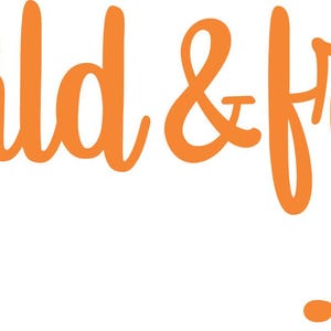 May include: Orange graphic with an arrow design and the text "wild & free".