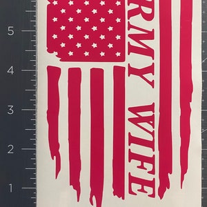 May include: A distressed American flag design in pink with white stars and the words "Army Wife" in white.