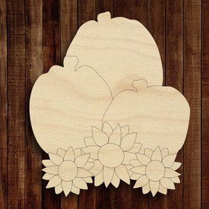 May include: Three wooden pumpkins with sunflower accents. The pumpkins are unfinished and ready to be painted or stained.