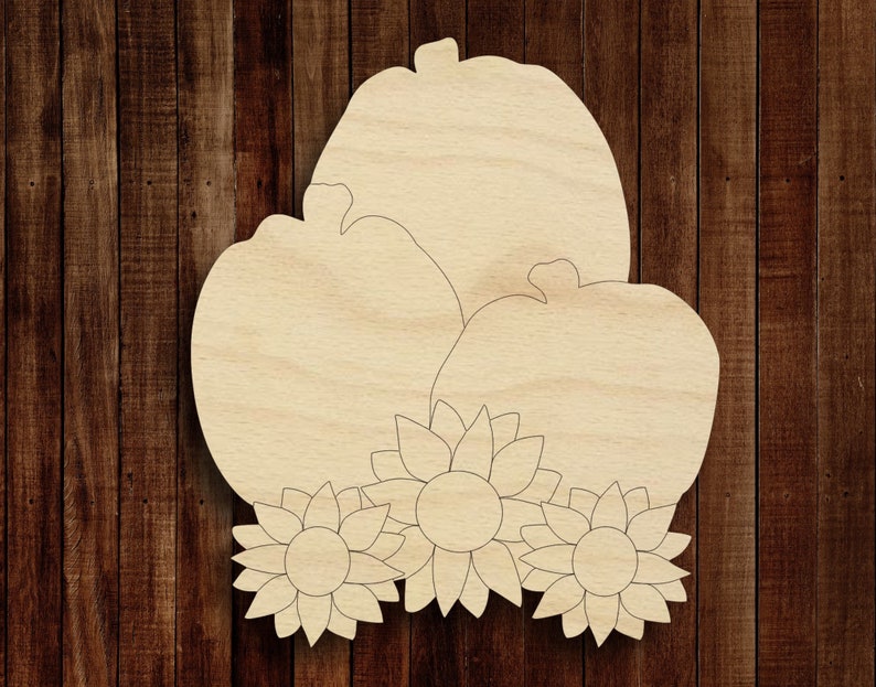 May include: Three wooden pumpkins with sunflower accents. The pumpkins are unfinished and ready to be painted or stained.