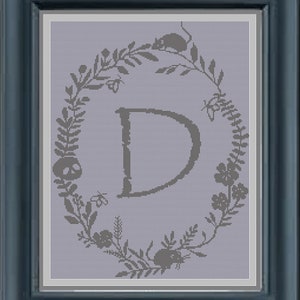 Patrón de punto de cruz con letra “D” del alfabeto gótico monograma