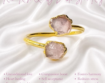 May include: A gold-toned open ring featuring two raw, pale pink rose quartz stones. The text at the top reads Raw Rose Quartz Double Stone Ring. The bottom text lists benefits including Unconditional love, Heart healing, Emotional soothing, Inner peace, Compassion boost, Self acceptance, Calming energy, Attracts love, Fosters harmony, Reduces stress, Comforts grief, and Boosts self esteem.