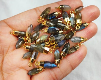 May include: A collection of gold-plated labradorite gemstone pendants with a pointed tip. Each pendant has a loop at the top for attaching to jewellery.
