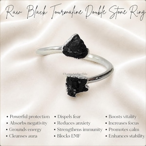 Könnte beinhalten: Ein silberfarbener offener Ring mit zwei rauen, gezackten schwarzen Turmalinsteinen an den Enden. Der Text lautet: Raw Black Tourmaline Double Stone Ring, CharmsAndSpellsIn, Powerful protection, Absorbs negativity, Grounds energy, Cleanses aura, Dispels fear, Reduces anxiety, Strengthens immunity, Blocks EMF, Boosts vitality, Increases focus, Promotes calm, Enhances stability.