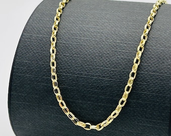May include: A gold chain necklace with a delicate, oval-shaped link pattern.