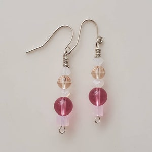 Pink and translucent white beads in varying shapeswith silver wire