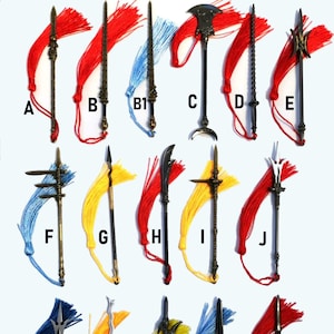 May include: A collection of 14 miniature decorative weapons with tassels. The weapons are made of metal and have different designs, including swords, spears, and axes. The tassels are in various colours, including red, blue, yellow, and gold.