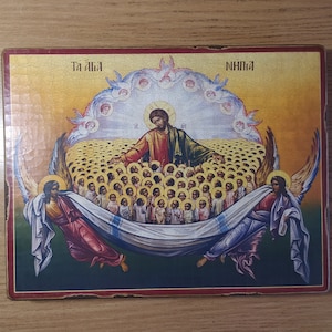May include: A religious icon depicting Jesus Christ surrounded by angels and a multitude of people. The icon is painted in a traditional style with vibrant colors and gold accents. The text "T&aacute; &aacute;la" and "N&iacute;hnia" is visible at the top of the icon.