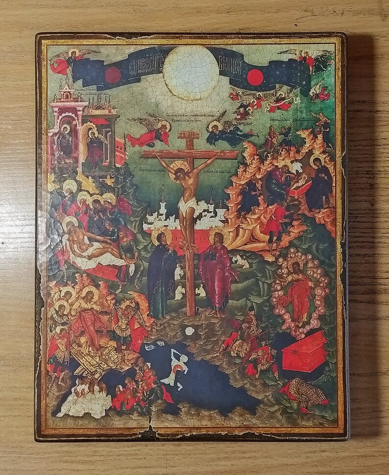 May include: A religious icon depicting the crucifixion of Jesus Christ. The artwork features a central figure on a cross, surrounded by other figures and angels. The color palette includes reds, blues, and golds, with a distressed, aged appearance.