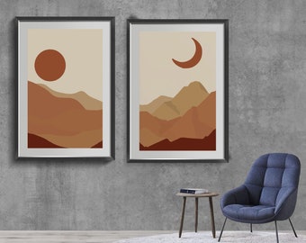 Puede incluir: Dos impresiones enmarcadas de paisajes abstractos con un estilo minimalista. La impresión de la izquierda presenta un sol rojo y montañas marrones. La impresión de la derecha presenta una luna creciente y montañas marrones.