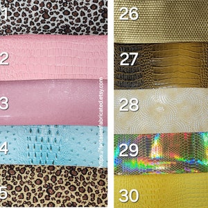 May include: A collection of ten different faux leather fabric swatches. The swatches are arranged in two columns of five. The swatches are numbered 21 through 30. The swatches feature a variety of patterns, including leopard print, crocodile, and snakeskin.
