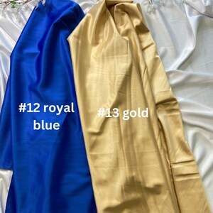 May include: Two fabric swatches, one royal blue labeled #12 royal blue and one gold labeled #13 gold.