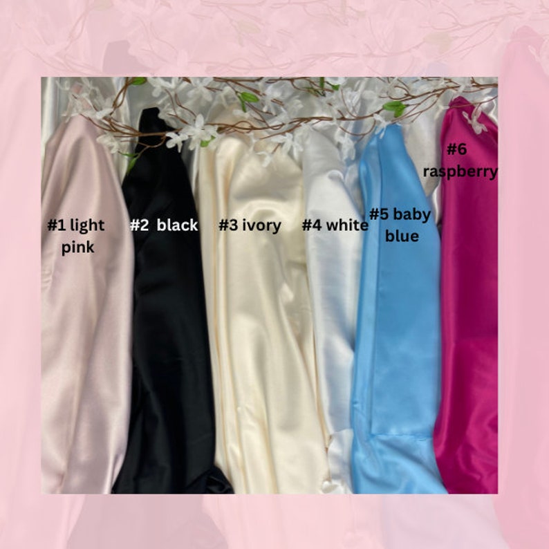 May include: Six fabric swatches in different colors: light pink, black, ivory, white, baby blue, and raspberry. The swatches are labeled with numbers 1 through 6 and color names.