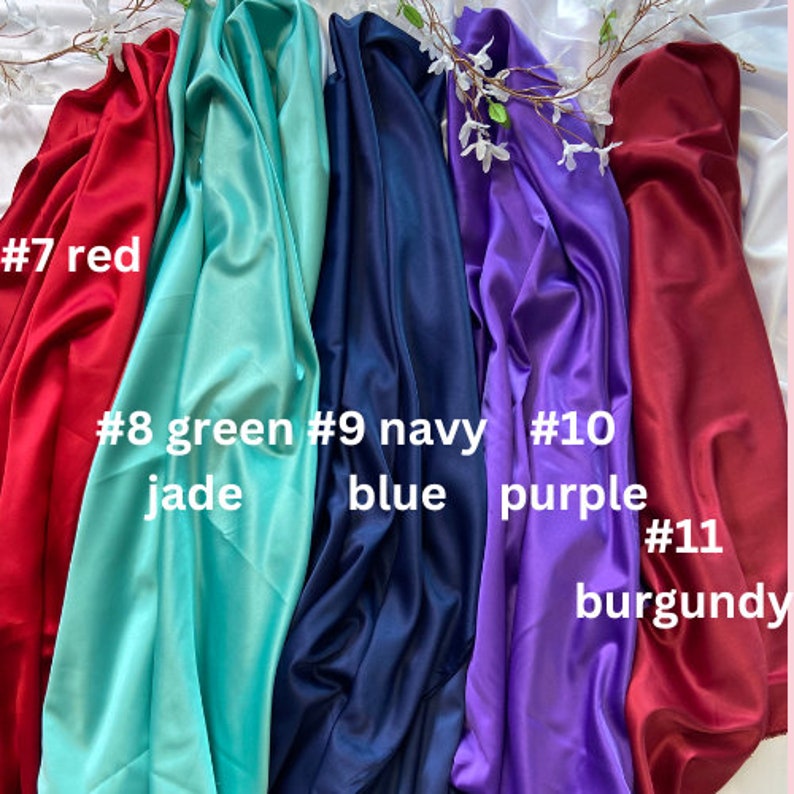 May include: Five fabric swatches in different colors: red, green jade, navy blue, purple, and burgundy. The swatches are labeled with numbers 7 through 11.