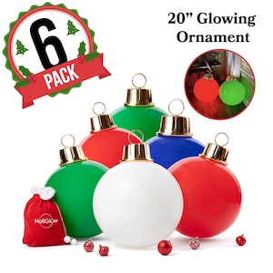 May include: A set of six large, colorful Christmas ornaments. The ornaments are red, green, blue, and white, with gold-colored caps. The image also includes a small red bag with the text "HoliGlow" and a small inset showing a glowing red and green ornament. The text "20" Glowing Ornament" is visible.