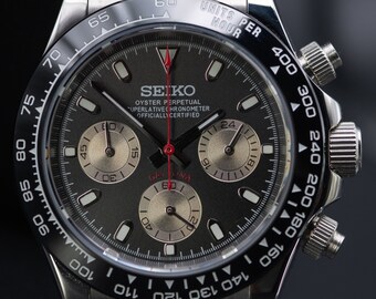 Seiko homage Daytona Stainless steel black dial Moonrock sub dials. Chronograph racing watch with stainless steel bracelet. RED HAND EDITION