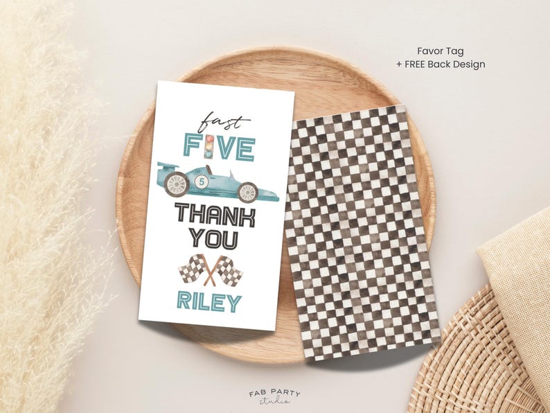 May include: A pair of favor tags with a racing theme. One tag features a light blue race car, the words "fast FIVE", "THANK YOU", and "RILEY". The other tag has a black and white chequered pattern.