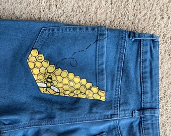 bee painting on jeans