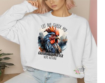 May include: White sweatshirt with a colorful rooster illustration and the text "Let me check my giveashitometer nope nothing".