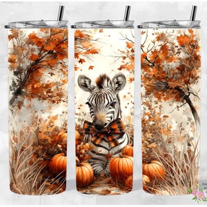 May include: A watercolor-style illustration of a zebra with a plaid bow tie standing in a fall forest setting. The zebra is surrounded by pumpkins and fall leaves. The image is perfect for a tumbler design.