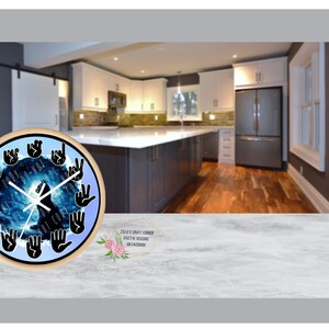 May include: A round wooden clock with a blue background and black hands. The clock face features a black wolf silhouette and a circle of black hands in various sign language positions.