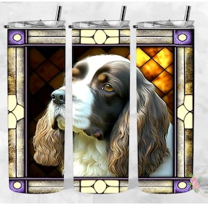 May include: A stained glass design featuring a brown and white Springer Spaniel dog with a purple, gold, and brown frame. The dog is looking to the right of the image.