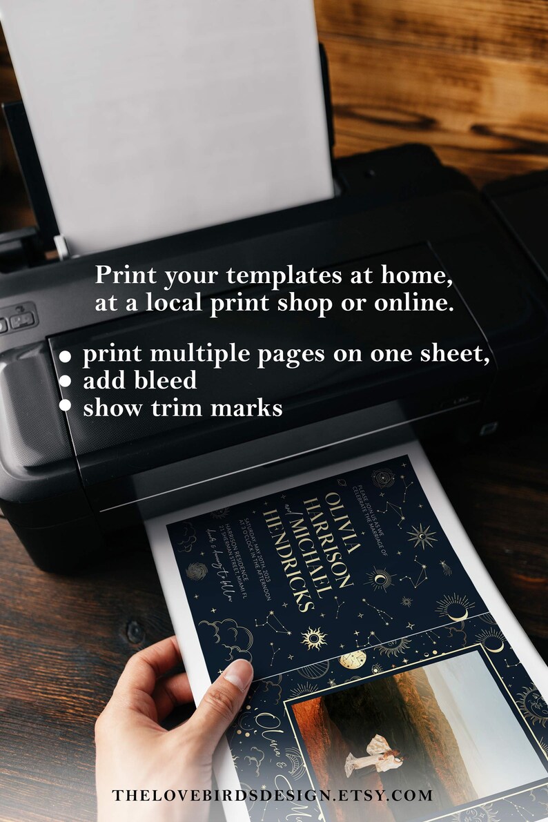 May include: A printer printing a wedding invitation with a celestial theme. The invitation features a dark blue background with gold stars, moons, and planets. The text on the invitation reads "Olivia Harrison and Michael Hendricks".