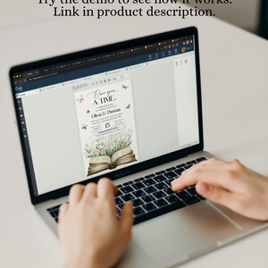 May include: A laptop computer displaying a wedding invitation with a floral design and the text "Once upon a time... Olivia & Thomas" and "August 15".