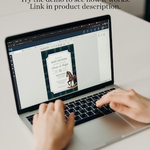 May include: A laptop screen showing a baby shower invitation design. The invitation has a navy and green tartan border, with the words "BABY SHOWER" and details for Lauren & Ralph's event on the 15th. The text "Try the demo to see how it works. Link in product description." is also visible.