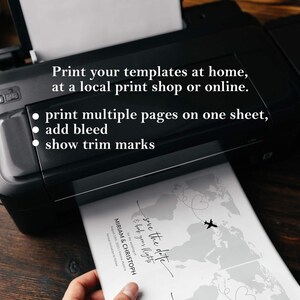 May include: A black printer printing a save-the-date card. The card features a world map design with airplane illustrations and the text "save the date & book your flights". The printer also has text that says "Print your templates at home, at a local print shop or online."