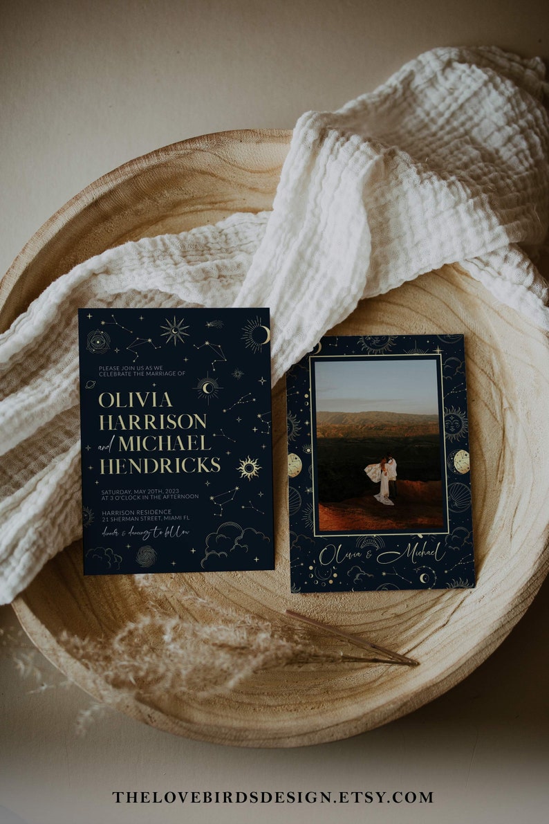 May include: A navy blue wedding invitation with gold celestial illustrations and text. The invitation reads "Please join us as we celebrate the marriage of Olivia Harrison and Michael Hendricks. Saturday, May 20th, 2023 at 3 o'clock in the afternoon. Harrison Residence, 21 Sherman Street, Miami FL.  Book & Dining to follow."