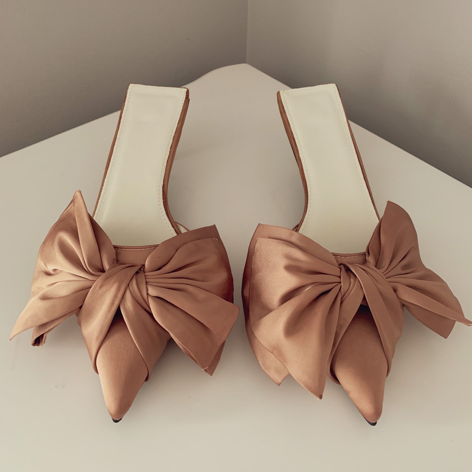 nude bow mules