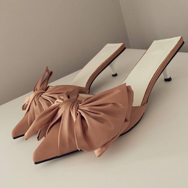 nude bow mules