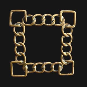 May include: A square, antique gold-colored frame composed of interlocking chain links and square corner pieces. The frame is set against a black background, highlighting its intricate design and metallic finish. The design is symmetrical and geometric.