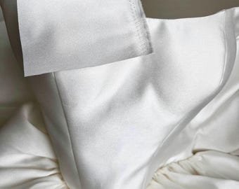 Feel the material of our Cat Eye Corset Ball Gown Wedding Dress with The Basque Drop Waist