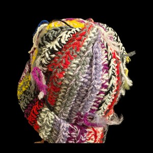 May include: A white ceramic mug with a black handle and the text "But First, Coffee" in a black, bold font. The mug is on a white surface. The mug is approximately 4 inches tall.