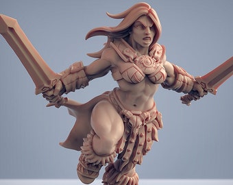 May include: A miniature figurine of a female warrior with a fierce expression, holding two swords. She is wearing a leather skirt and bra with a decorative belt. The figurine is painted in a light brown color.