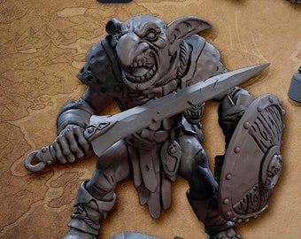 May include: Two 3D printed goblin miniatures, one holding a sword and shield, the other holding a spear. The miniatures are painted in a gray color and are standing on a brown background. The text "v1" and "v2" are visible in the image. The text "ALTERNATIVE VERSION! BALLJOINT WEAPONS!" is also visible in the image.
