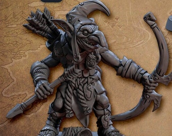 May include: Two miniature goblin figures, one holding a bow and arrow and the other holding a shield and spear. The figures are painted in a gray color and are standing on a brown base. The text "v1" and "v2" are visible in the image. The text "Alternative Version! Balljoint Weapons!" is also visible in the image.